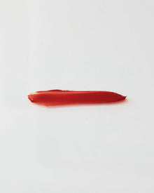 Dark Red lip gloss swatch on a white background