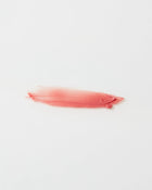 Pink lip gloss swatch on a white background