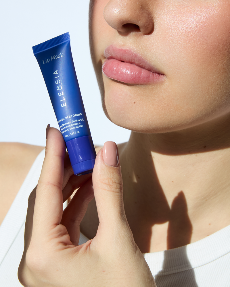 ELEUSIA Barrier Restoring Lip Mask in Cucumber product in hand, moisturizing treatment product.