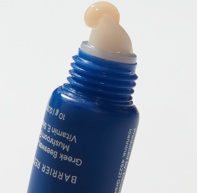 Blue lip applicator with lip mask on a white background