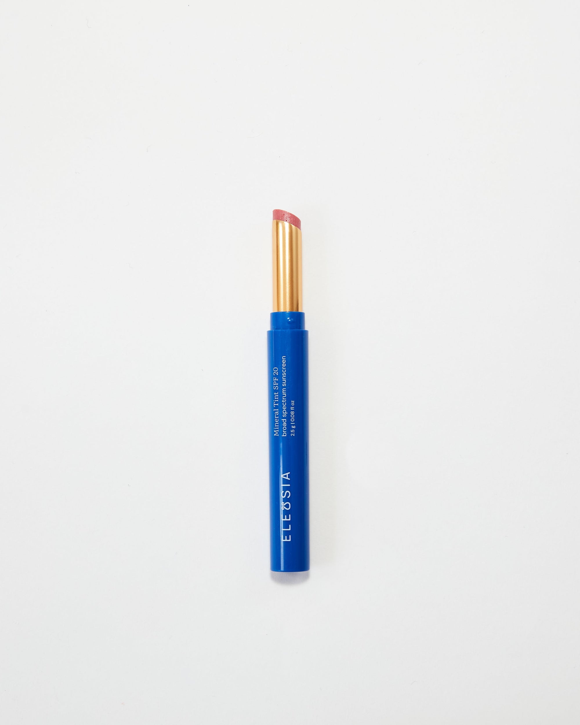 Blue Eleusia lip tint with pink cap on a white background