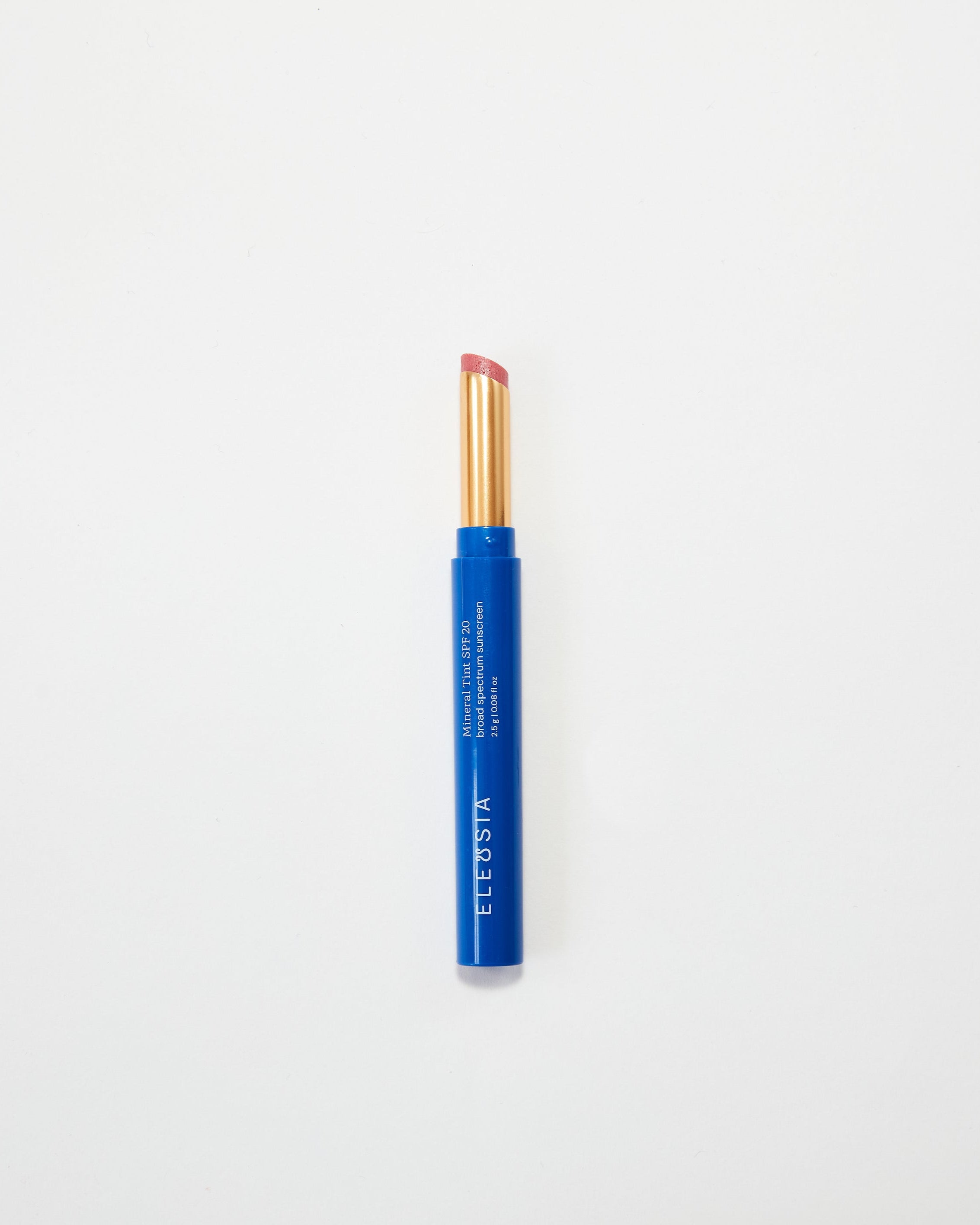 Blue Eleusia lip tint with pink cap on a white background