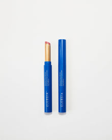 Two blue Eleusia lip products with visible branding on a white background
