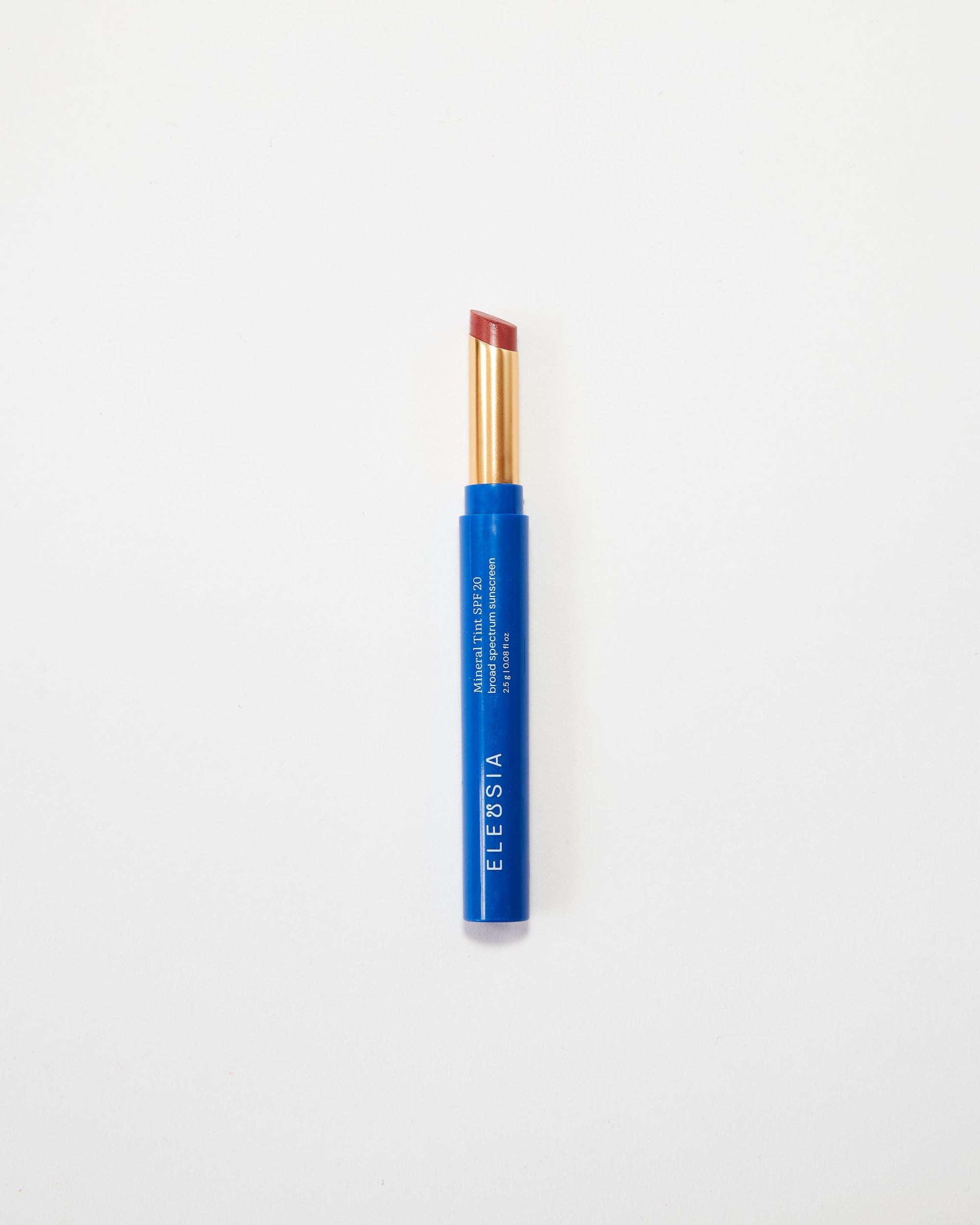 Blue Eleusia lip tint with visible brand name on a white background